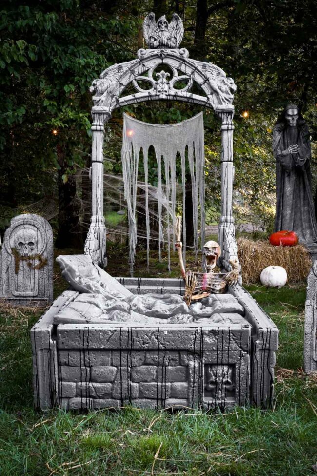 Skeleton Resting in Bed Graveyard Scene